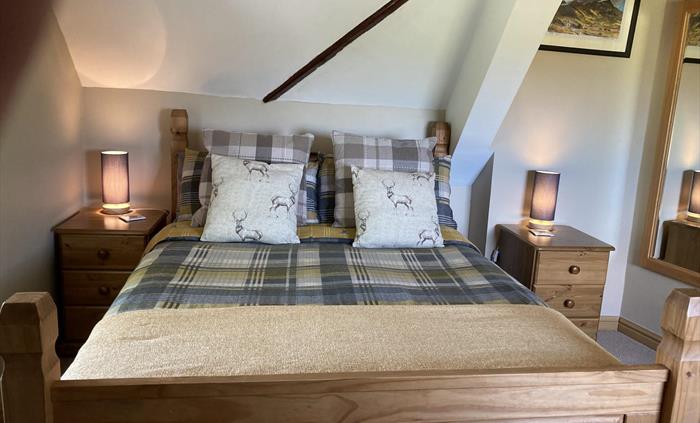A double room for 2 with ensuite shower. Over looking the lake to front and across to the Snowdonia Mountain range from the side windows.